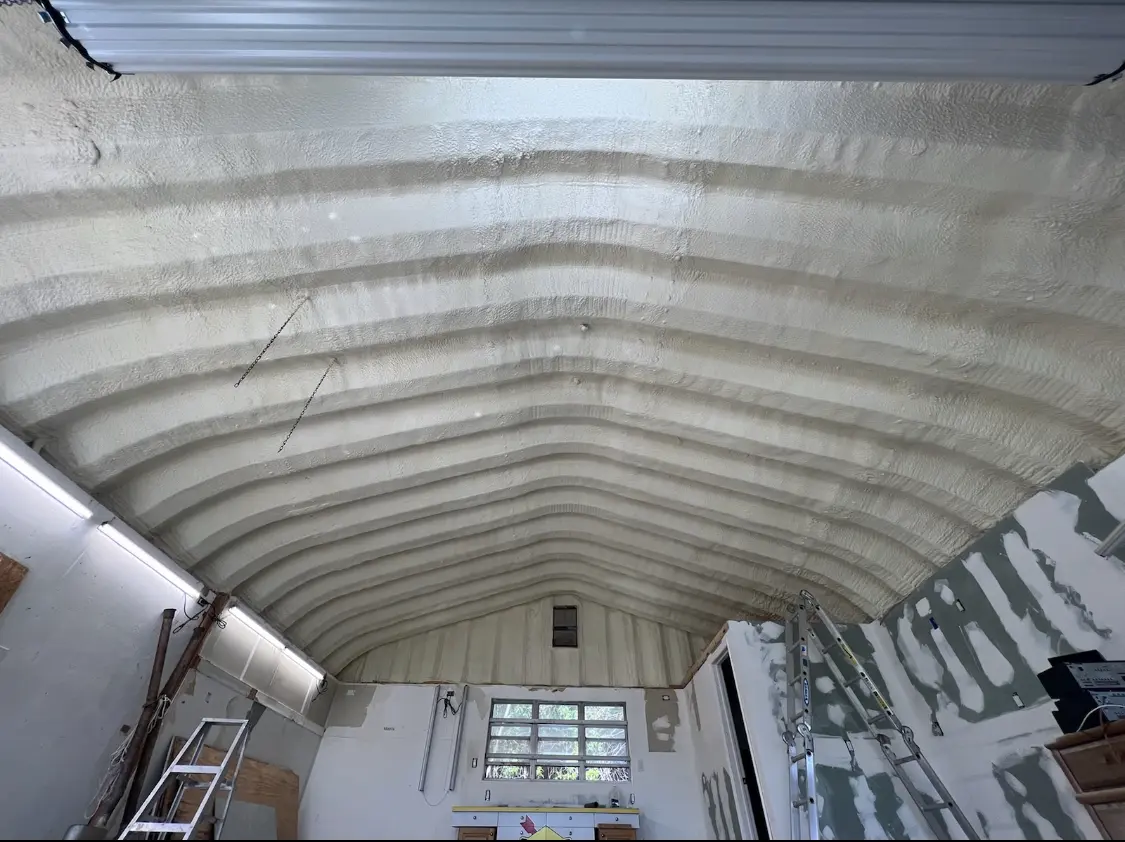 Spray polyurethane foam applied to the underside of a metal roof deck in Willmar
